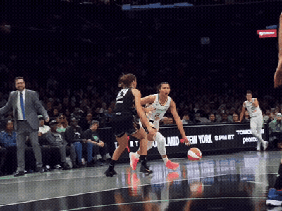 A Basketball Game Is Being Played In Front Of A New York Advertisement GIF