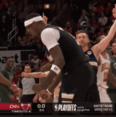 A Basketball Game Is Being Played In Front Of A Playoffs Banner GIF