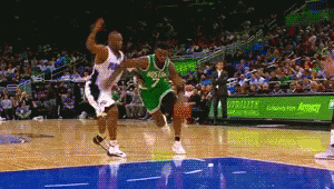 A Basketball Game Is Being Played In Front Of A Sign For Aeropostale GIF