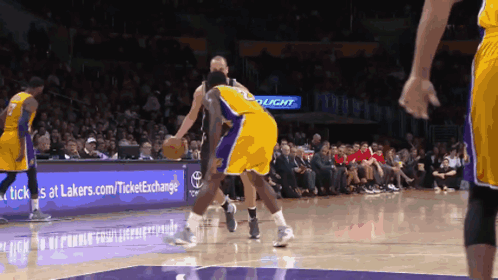 A Basketball Game Is Being Played In Front Of A Sign That Says Bud Light GIF