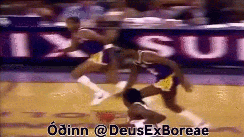 A Basketball Game Is Being Played In Front Of A Sign That Says " Ixsui " GIF