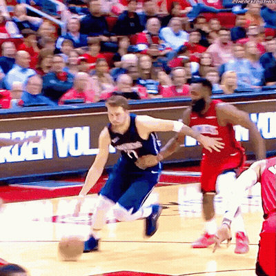A Basketball Game Is Being Played In Front Of A Sign That Says ' Rzen Vol ' On It GIF