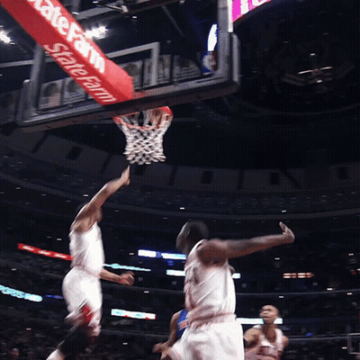 A Basketball Game Is Being Played In Front Of A Sign That Says State Farm GIF