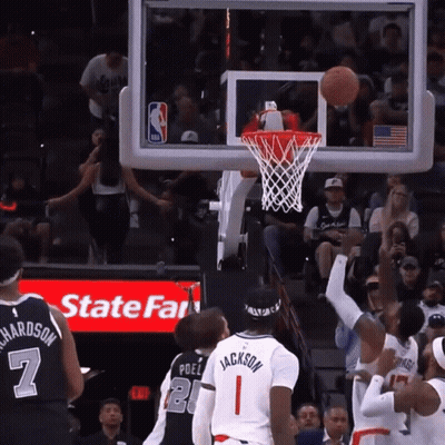 A Basketball Game Is Being Played In Front Of A State Farm Ad GIF