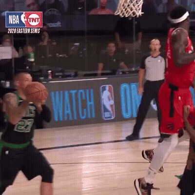 A Basketball Game Is Being Played In Front Of A Tnt Sign GIF