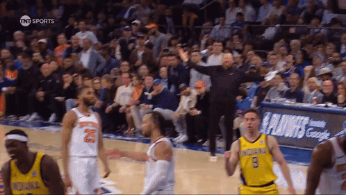 A Basketball Game Is Being Played In Front Of A Tnt Sports Banner GIF