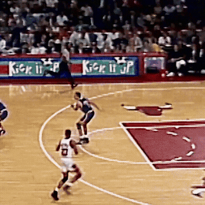 A Basketball Game Is Being Played In Front Of An Ad For Kick It Jp GIF