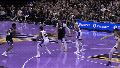 A Basketball Game Is Being Played In Front Of An Ipassword Banner GIF