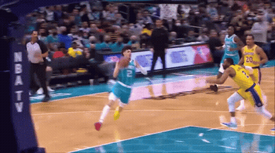 A Basketball Game Is Being Played In Front Of An Nba Tv Sign GIF