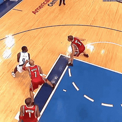 A Basketball Game Is Being Played In The America Center GIF