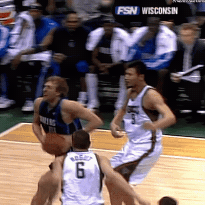 A Basketball Game Is Being Played In Wisconsin With A Fsn Logo In The Background GIF