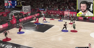 A Basketball Game Is Being Played On A Computer Screen With A Crowd Watching . GIF