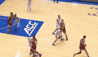 a basketball game is being played on a court sponsored by acc and coach k