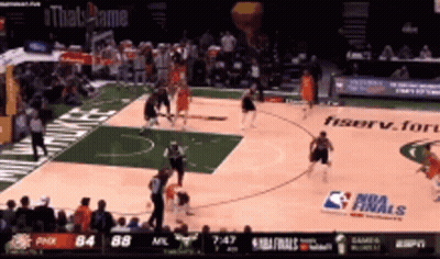 A Basketball Game Is Being Played On A Court That Has A Nba Finals Sign On It GIF