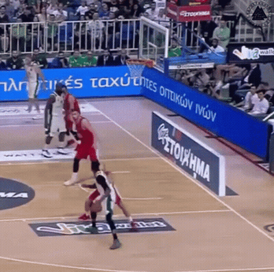 A Basketball Game Is Being Played On A Court That Has A Sign That Says Stoiathma GIF