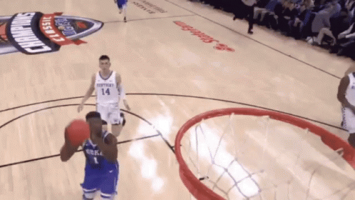 A Basketball Game Is Being Played On A Court That Has Kentucky Classic Written On It GIF