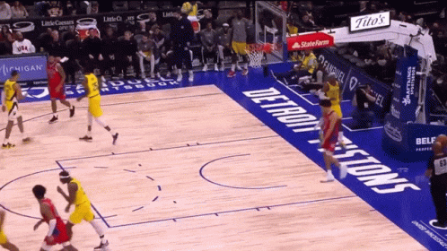 A Basketball Game Is Being Played On A Court That Has The Word Detroit On It GIF