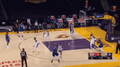 A Basketball Game Is Being Played On A Court That Has The Word Lakers On It GIF