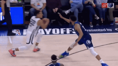 A Basketball Game Is Being Played On A Court That Has The Word Payoffs On It GIF