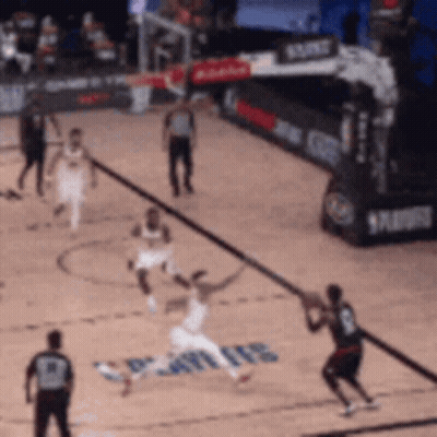 a basketball game is being played on a court that has the word spurs on the floor