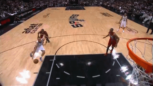A Basketball Game Is Being Played On A Court That Says At & T Center GIF