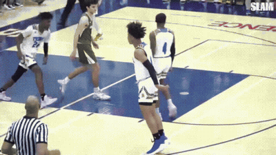 A Basketball Game Is Being Played On A Court That Says Slam GIF