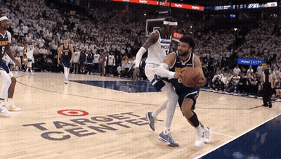 A Basketball Game Is Being Played On A Court That Says Target Center GIF