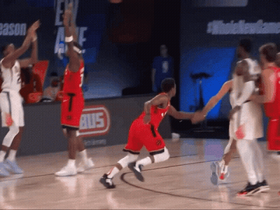A Basketball Game Is Being Played On A Court With A Bus Sign In The Background GIF
