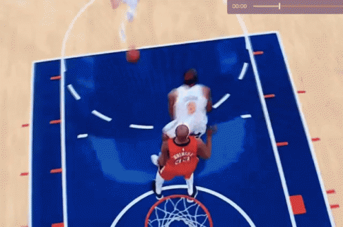 A Basketball Game Is Being Played On A Court With A Clock Showing 0:01 GIF