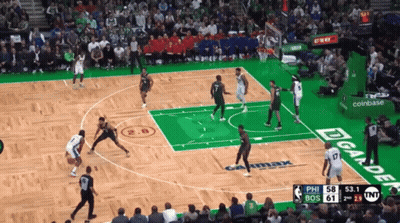 A Basketball Game Is Being Played On A Court With A Coinbase Ad GIF