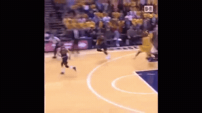 A Basketball Game Is Being Played On A Court With A Crowd In The Stands Watching . GIF