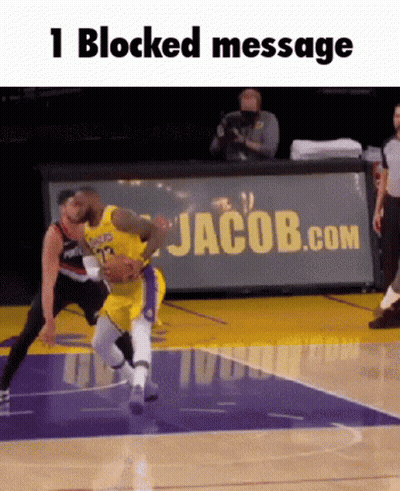 A Basketball Game Is Being Played On A Court With A Jacob.com Banner In The Background GIF
