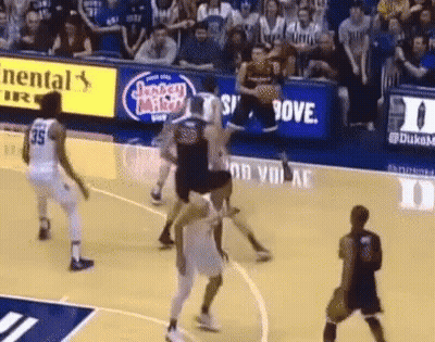 A Basketball Game Is Being Played On A Court With A Jersey Miller Ad In The Background GIF