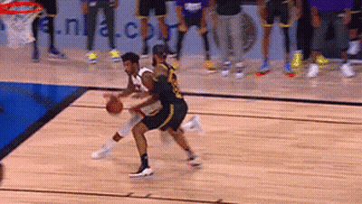 A Basketball Game Is Being Played On A Court With A Nba.com Banner In The Background GIF