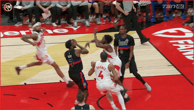 A Basketball Game Is Being Played On A Court With A Sign That Says Fan On It GIF