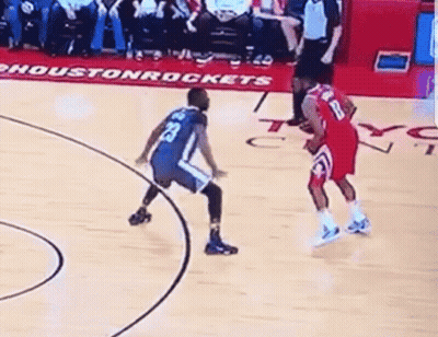 A Basketball Game Is Being Played On A Court With A Sign That Says Houston Rockets On It GIF