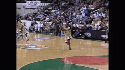 A Basketball Game Is Being Played On A Court With A Sign That Says Swg GIF