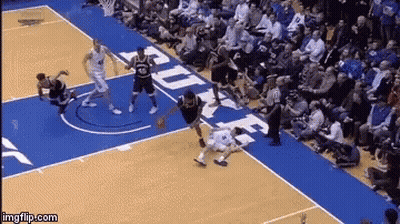 A Basketball Game Is Being Played On A Court With Duke Written On It GIF