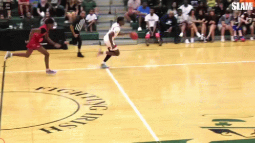 A Basketball Game Is Being Played On A Court With Fighting Irish Written On The Floor GIF