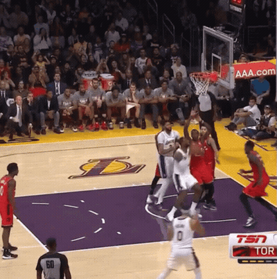 A Basketball Game Is Being Played On A Court With The Lakers Logo GIF