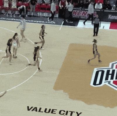 A Basketball Game Is Being Played On The Floor Of Value City GIF