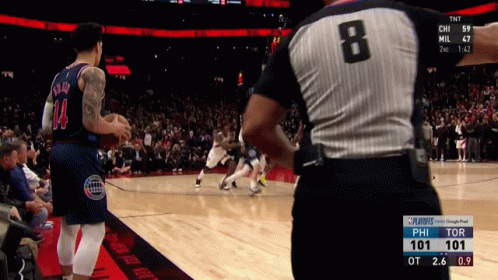 A Basketball Game Is Being Played With A Referee Wearing Number 8 GIF