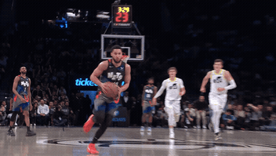 A Basketball Game Is Being Played With A Scoreboard That Says 339 On It GIF