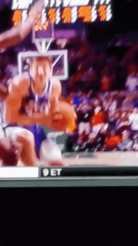 A Basketball Game Is Being Shown On A Television Screen With The Word Get On The Bottom GIF