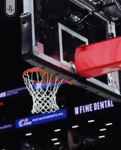 A Basketball Going Through A Net With A Fine Dental Sign Behind It GIF