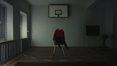 A Basketball Hoop With A Red Shirt On A Chair In Front Of It GIF