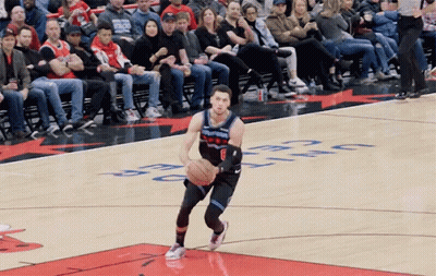 A Basketball Player Dribbles A Ball On A Court With The Word Celtics On It GIF
