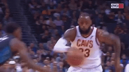 A Basketball Player For The Cavs Dribbles The Ball During A Game GIF
