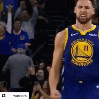 A Basketball Player For The Golden State Warriors Is Standing In Front Of A Crowd GIF