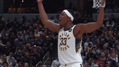 A Basketball Player For The Indiana Pacers Celebrates With His Arms In The Air GIF